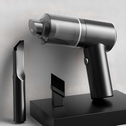 Black and silver handheld vacuum cleaner with attachments on a light gray background