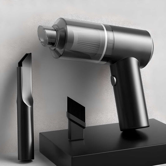 Black and silver handheld vacuum cleaner with attachments on a light gray background