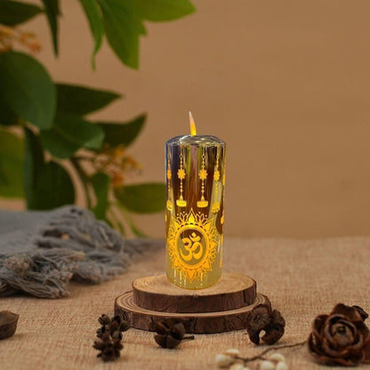 Decorative candle with Om symbol on a wooden stand against a natural background